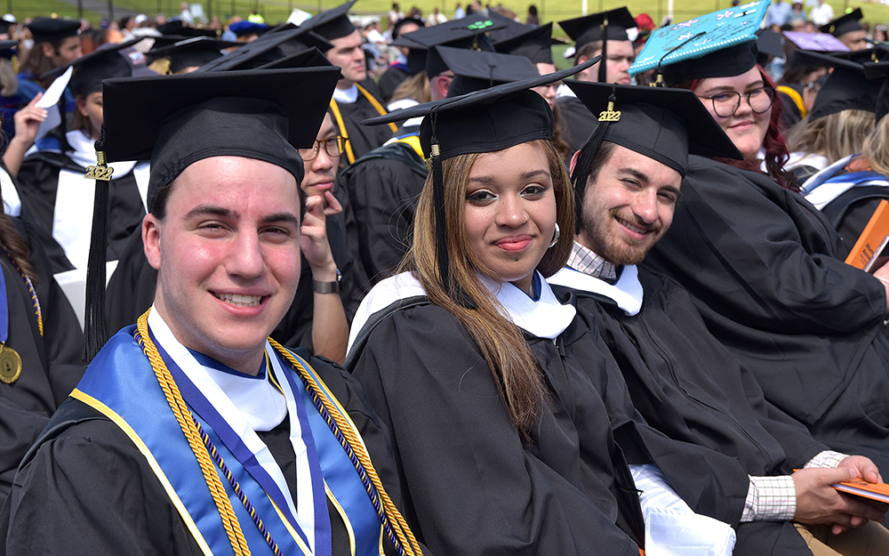 students sitting at commencement ceremony