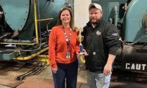 WCSU Interim AVP, Facilities Management & Planning, Deanna Cibery-Schaab and WCSU Building Maintenance Supervisor Kyle Brennan with their SEMS Champion Award.