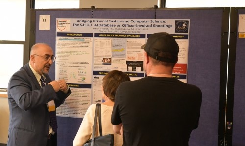 Dr. Hasan Arslan explains his award-winning research during Sigma Xi's Northeast Regional Research Conference.